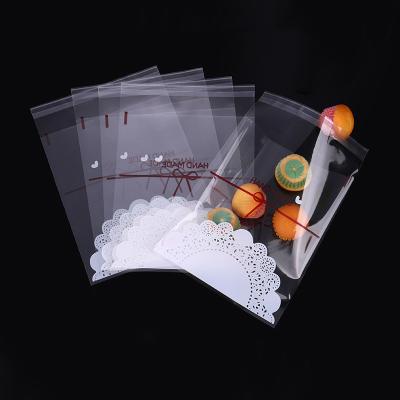 China 100/Pack Clear Plastic Opp Candy Seal Cookie Packing Bag Self-adhesive White Cookie Wholesale Ziplock Bag for sale