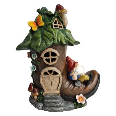 China Europe Resin Garden Statue Funny Gnome Slept In Boot Hand Grip Shovel for sale