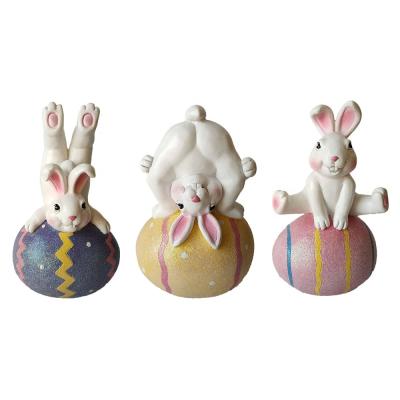 China Europe Resin Open Funny Easter Rabbit Playing Inside Egg Sculpture Decorative Popular Cartoon Animal Statue for sale