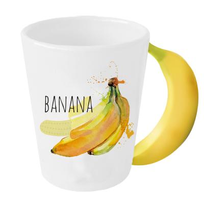 China Fancy Eco Sustainable Ceramic Coffee Cups And Mugs With 3D Fruit Banana Handle For Gift for sale