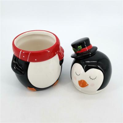 China Ceramic Cute Stocked Cartoon Emboss Penguin Shape Cookie Jars With Lids For Cookies Home Decor for sale