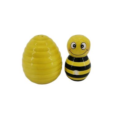 China Viable custom ceramic cute kawaii bee yellow salt and pepper shaker and bee egg set for decoration for sale