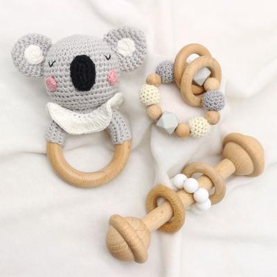 China Toy Food Grade Baby Soft Teether Toys Natural Organic Cotton Teethering Wooden Rattle Soft Hook Ring for sale