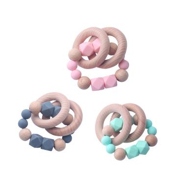 China Wooden Teether Ring Easy To Hold Baby Teether Food Grade Silicone Pendant Bracelet High Quality Infant Chain Beech Silicone Bead for sale