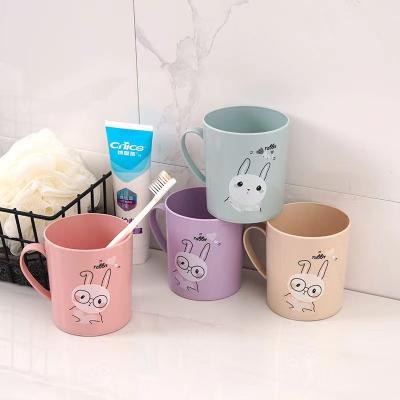 China Sustainable Bunny Cartoon Drinking Cup Plastic Gargle Cup Toothbrush Wash Cup With Handle for sale