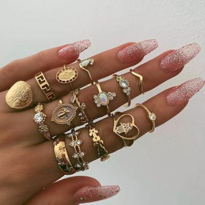 China New Set of 15 Pieces Fashion Retro Diamond Jewelry Alloy Cross Jewel Shield Gold Plated Ring Set for sale