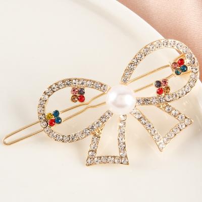 China 2022 new Korean designer hair accessories soft wholesale diamond bow hairpin all match pearl frog hairpin for sale