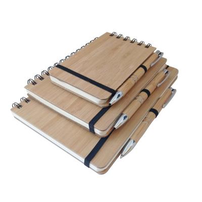 China Recyclable Customizable Eco-Friendly A5 A6 Hardcover Notepad with Pen Spiral Bamboo Wooden Notebook for sale