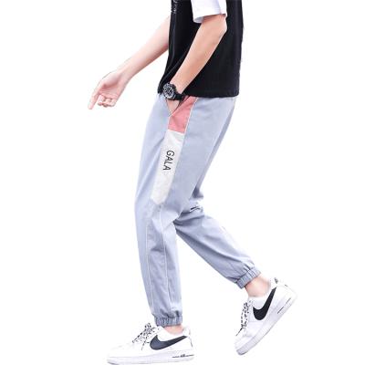 China Anti-wrinkle 2021 Autumn And Winter Casual Striped Mens Pants OEM Customized Slim Fitness Training Running Woven Pants for sale