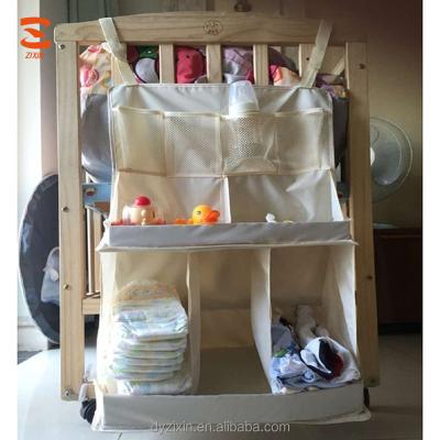 China 100% Eco-Friendly Baby Crib Organizer Storage Nursery Bag Hanging Diaper Organizers with Pockets Large Baby Changing Table for sale