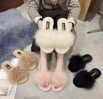 China Fashion Trend Must Get Warm Winter Super Fluffy Plush Artificial Fur Indoor Home Slippers For Girl for sale