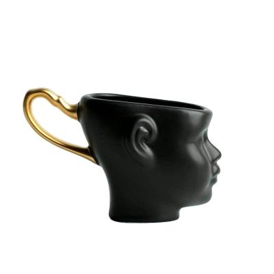 China Viable Cup Nordic Creative Couples Face Personality Mug Designer Style Gold Ceramic Discovery Coffee Mug for sale