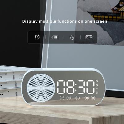 China Wireless Charger For Mini Cell Phone 2022 Mirror Subwoofer Player Audio Stereo Wireless Alarm Clock Blue Tooth Speaker for sale