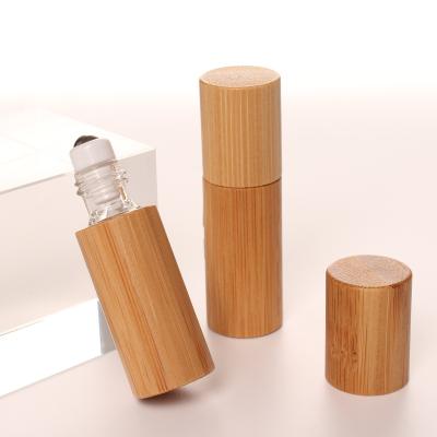 China Personal Skin Care Packaging Beautiful Style 5ml Portable Bamboo Cover Roll On Glass Bottle Lip Oil Container For Cosmetics Packaging for sale