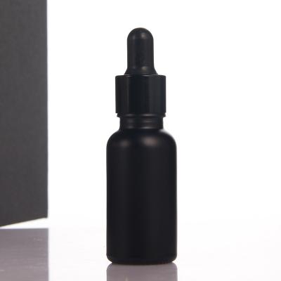 China Personal Skin Care Packaging 20ml Cylinder Shape Pipette Face Essential Oil Container Face Cream Pipette Rubber Glass Bottle Black Color for sale