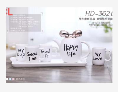 China Viable Luxury 6pcs Teapot Set Bone China Cup Tea Set Cute Bow Knot Cover Design Porcelain Tea Kettle With Tray for sale