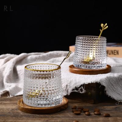 China New Viable Rotary With Iron Spoon Cup High Value Glass Beer Mugs With Wooden Bottom Wine Glasses for sale