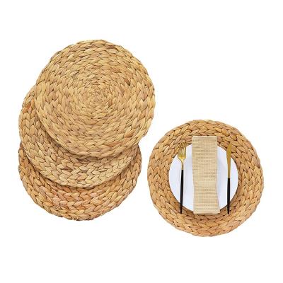 China Water Sustainable Woven Round Place Mats For Dining Table Woven Chargers Dish Hyacinth Mat For Tables for sale