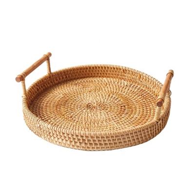 China Customized Elegant Handwoven Serving Dinner Wooden Handle Round Sustainable Natural Rattan Desk Storage Elegant Tray for sale