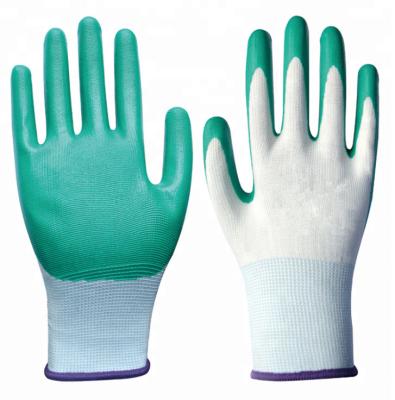 China Puncture And Tear Resistance Green Nitrile Coated Safety Working Gloves 13 Gauge Polyester Coating for sale