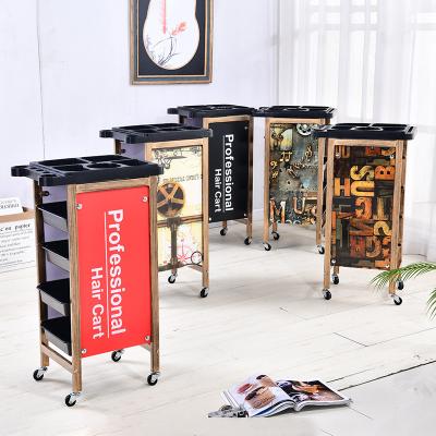 China Retro Hairdresser Black Slaon Trolley Rod Trolley Hair Salon Spa Push Wheel Trolley Modern Frame Storage Trolley Beauty for sale