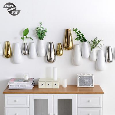 China Wall Hung Vase Modern Home Decoration Ceramic Material Colored Electroplate Wall Hung Vase for sale