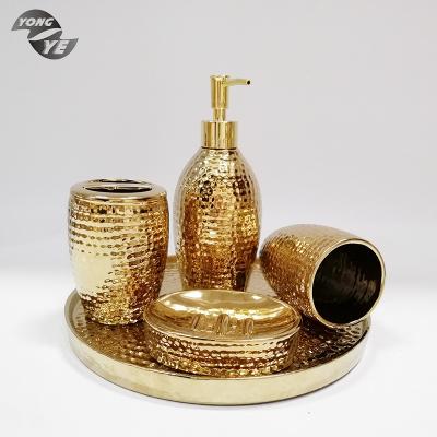 China Sustainable European Sleek Modern Style Bathroom Accessory Shiny Gold Ceramic Bathroom Set for sale