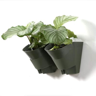 China 2 Pastoral Pocket DIY Self Watering Baskets Flower Pot Plastic Vertical Wall Planter With Holes for sale