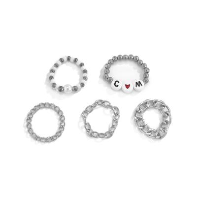 China FASHIONABLE Low Price Metal Chain Cavity And Stacking Imitation Pearl Letters Rice Pearl Set Heart-shaped Ring for sale