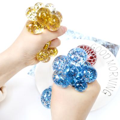 China Squeezable Hand Compression Toy Stress Relief Mesh Net Sensory Squishy Ball With Gold Powder Inside for sale