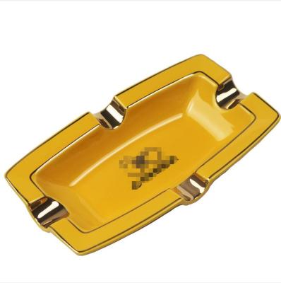 China Custom Wholesale Classic American Style Logo Ceramic Cigar Ashtray Yellow White Gold Plating for sale