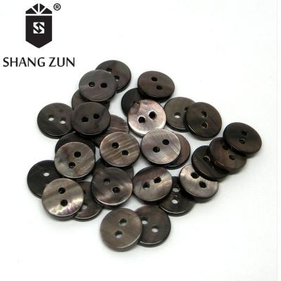 China Viable manufacturers export black pearl shell flat button natural color shell button winter sweater 2 holes button for sale