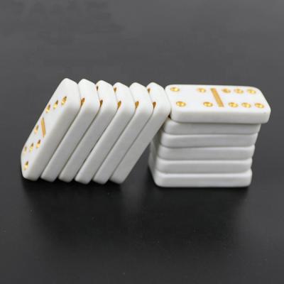 China Playing Game Professinal Small Cheap Dominoes Double Six Domino Games For White Tile With Gold And Yellow Dot for sale