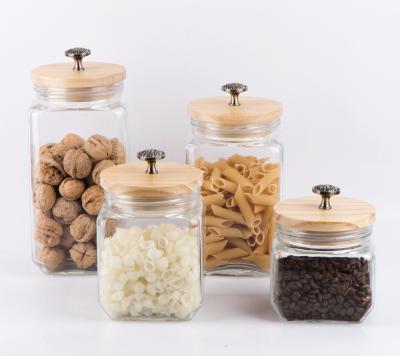 China Freshness Preservation CCP095WT 2100ml 1700ml 1250ml 850ml Square Glass Jar With Wooden Lid And Handle On The Lid for sale