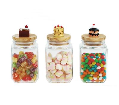 China Freshness Preservation CP038WH 500ML 750ml 1000ML Square Glass Jar With Lid And Decoration Wooden Cake On The Lid for sale