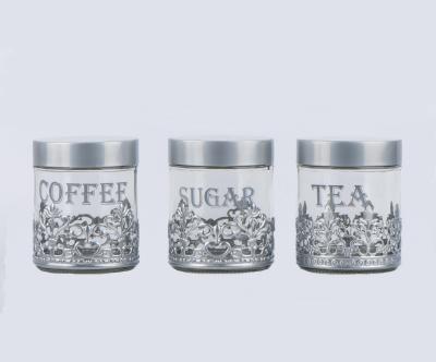 China Heatable 600ml Round Glass Jar With Engraved Metal Casing (CCP099T94-4) for sale