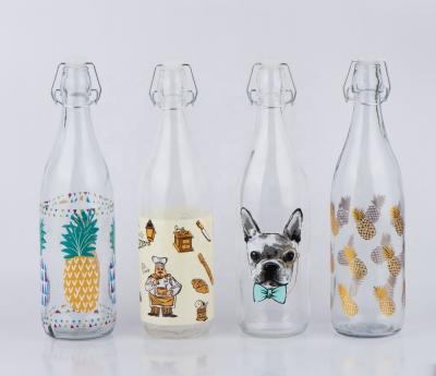 China CCP434K46 1L Viable Glass Milk Bottle Juice Bottle With Clip Lid With Decal Printing Pineapple Design for sale