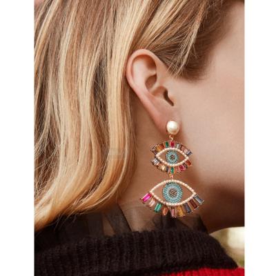 China Trendy Fashion Jewelry Rhinestone Devil Eyes Tassel Trendy Full Crystal Eye Earrings Colorful Earrings Along for sale