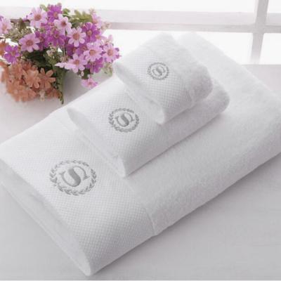 China Gift child safe luxury plain dyed 100 cotton hilton towel set with embroidered for hotel for sale