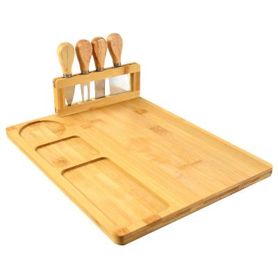 China Sustainable Bamboo Cutting Board Tray Serving Tray With 4 Pcs Tool+Ceramic Cheese Bowl for sale