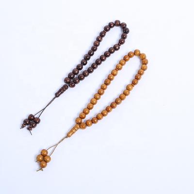 China 33pcs Religious Cheap Religious Log Beads Chain Rosary With Wooden Tassel Bracelet for sale