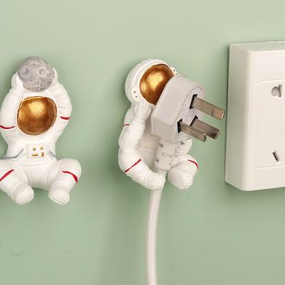 China Morden Bathroom Accessories Hanger Mains Cord Wall Decoration Storage Holder Punch Free Astronaut Hook for sale