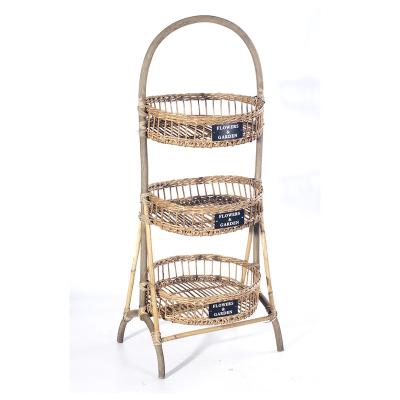 China 3 Layers Sustainable Rattan Food Fruit and Vegetable Storage Display Rack Handcrafted Rack Shelf with Wheels for sale