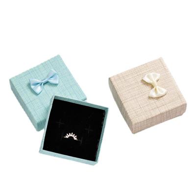 China Free Sample Recycled Colorful Paper Packaging Materials Fashionable Earring Bow Gift Listing Box With Custom Logo for sale