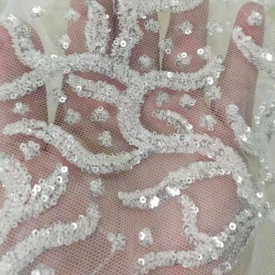 China Sequin Embroidery African Handmade Design Mesh Tulle Lace Fabric Fashion Long Lasting Elegant White Bridal Wear For Wedding Party Dress for sale