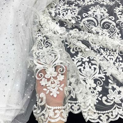 China Viable Luxury White Polyester Mesh Tulle Crystal Embroidery Beads Bridal Net Lace Fabric For Wedding Dress By Handmade for sale