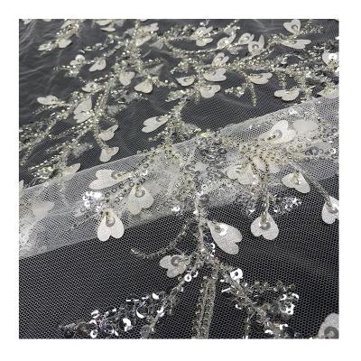 China Crystal Sequin Lace Luxury Design Bridal White Beaded Beaded Sheer Mesh 3D Embroidery Flower Fabric Tulle For Sewing Wedding Dress for sale