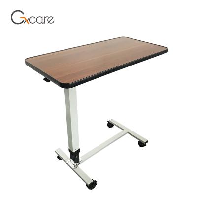 China Traditional Wooden Top Adjustable Hydraulic Hospital Over Bed Table With Wheels for sale