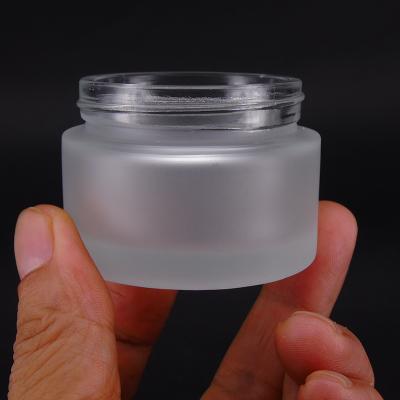 China Personal Care Wide Mouth And Thick Wall Frosted Glass Jar 50g 100g Clay Face Mask Ointment Glass Container for sale