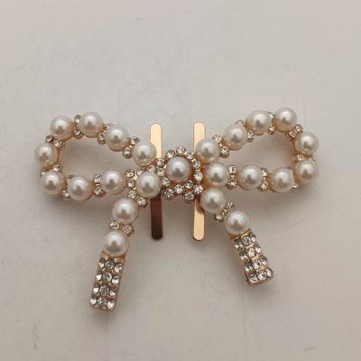 China Latest popular plastic fashionable bowknot rhinestone and pearl buckle for lady shoe accessory for sale